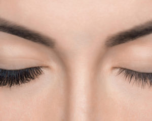 Eyelash Removal Procedure Close Up. Beautiful Woman With Long La